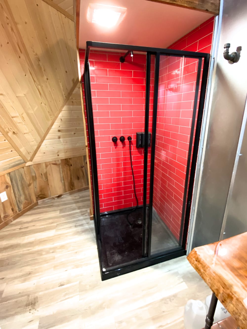 Shower with red subway tile