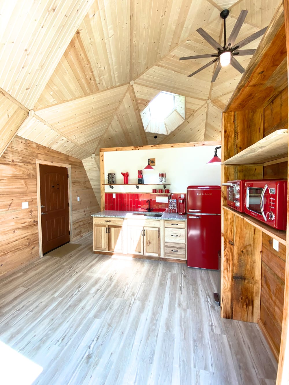 Kitchenette with a red refrigerator